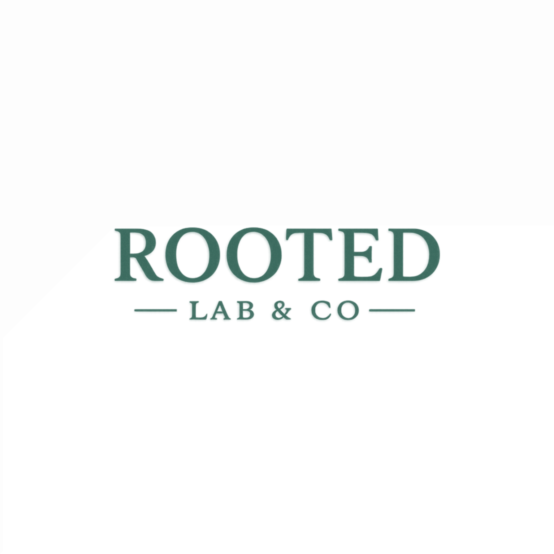 Rooted Lab & Co. logo, parent brand of The Perfect Part® Comb